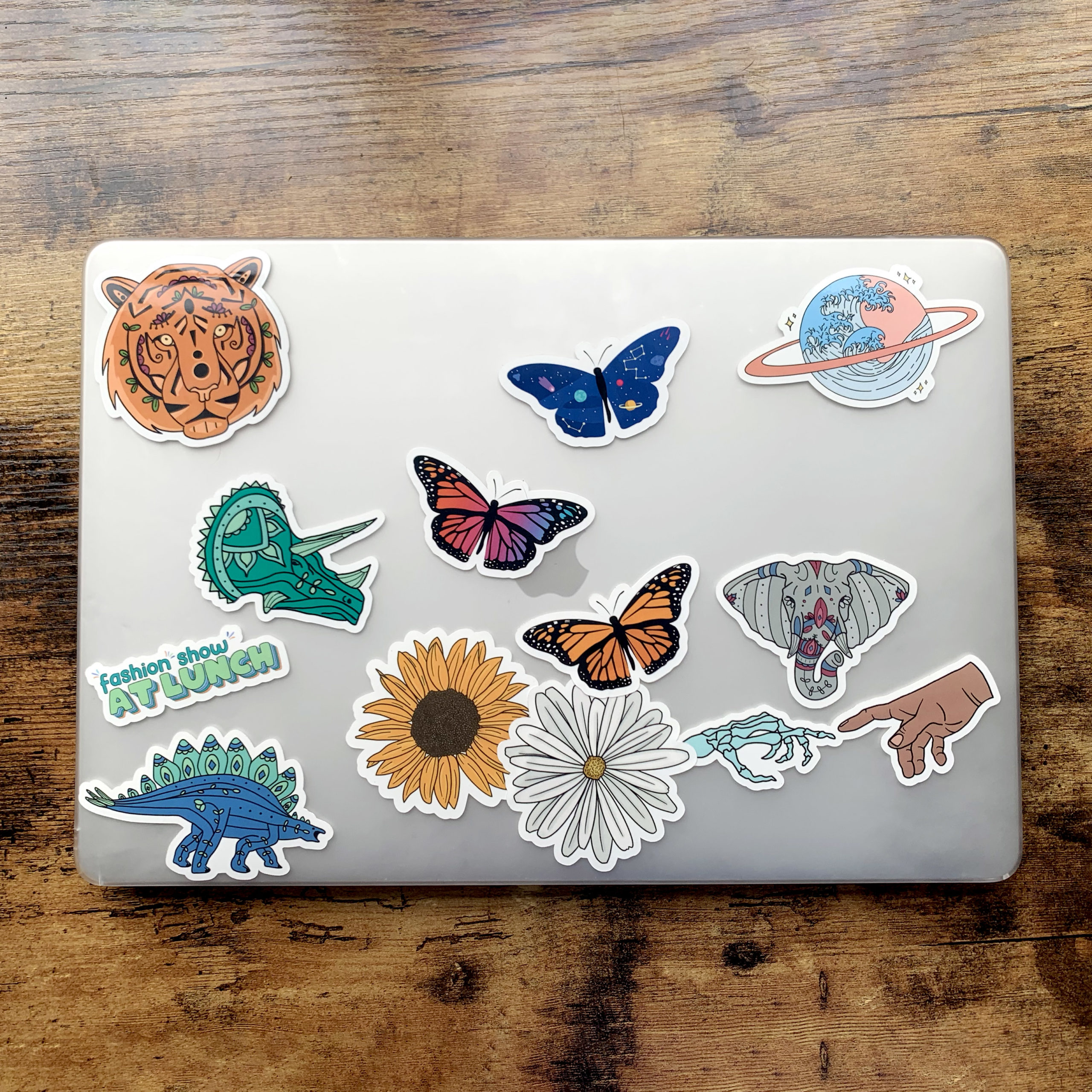 Variety of Super Cute Stickers on Laptop Sitting on Desk